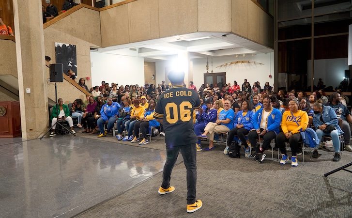 A person standing in front of an audience